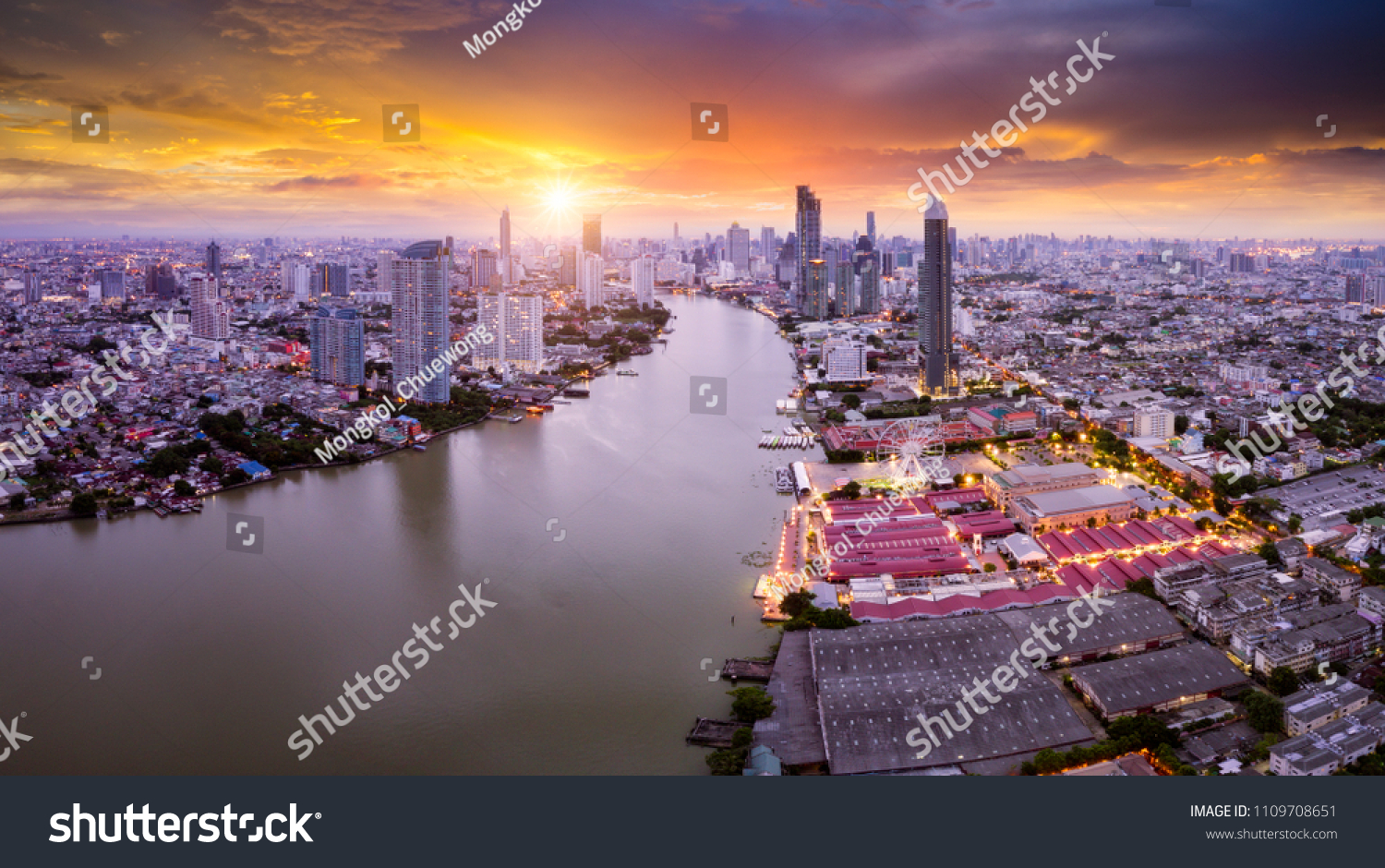 Aerial view of Bangkok skyline panorama and skyscraper in center of Bangkok city. Modern buildings condominium at Chao Phraya River Bangkok Thailand at sunrise.