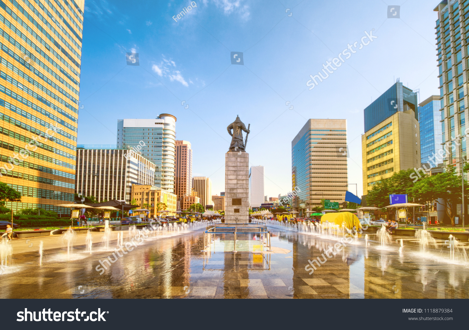 Sunset of Gwanghwamun Plaza with the statue of the Admiral Yi Sun-sin and modern buildings in downtown Seoul South Korea. 
