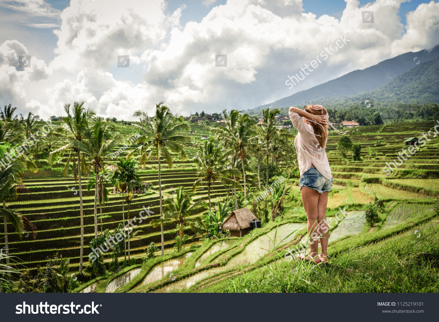 Beautiful  woman looking at beautiful tegallalang rice terrace in Bali  Indonesia
