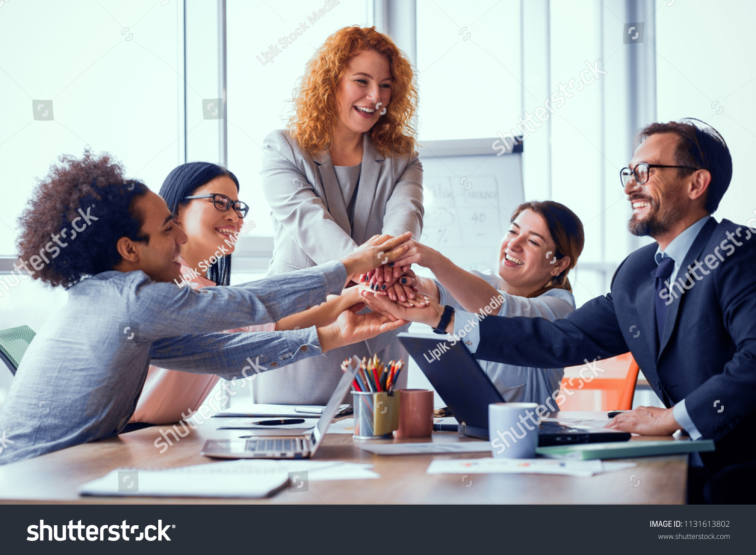 Business solution ready. Business team holding hands together. Successful work is done. Toned concept.