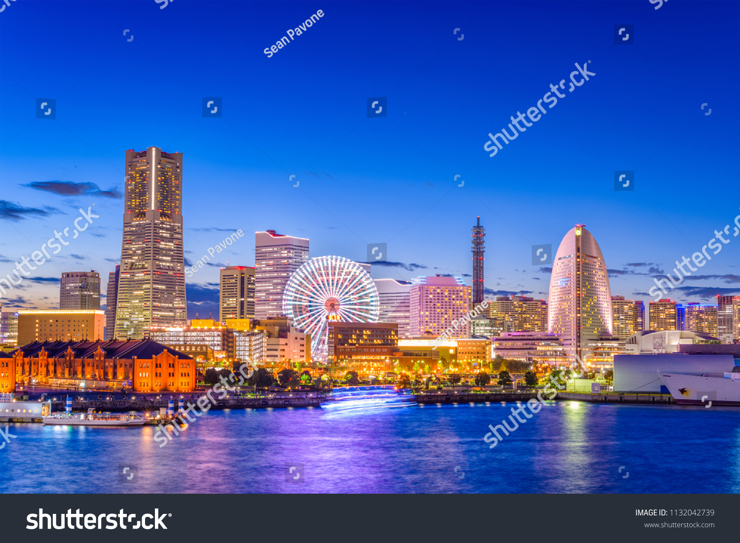 Yokohama  Japan city skyline from the bay at twilight.
