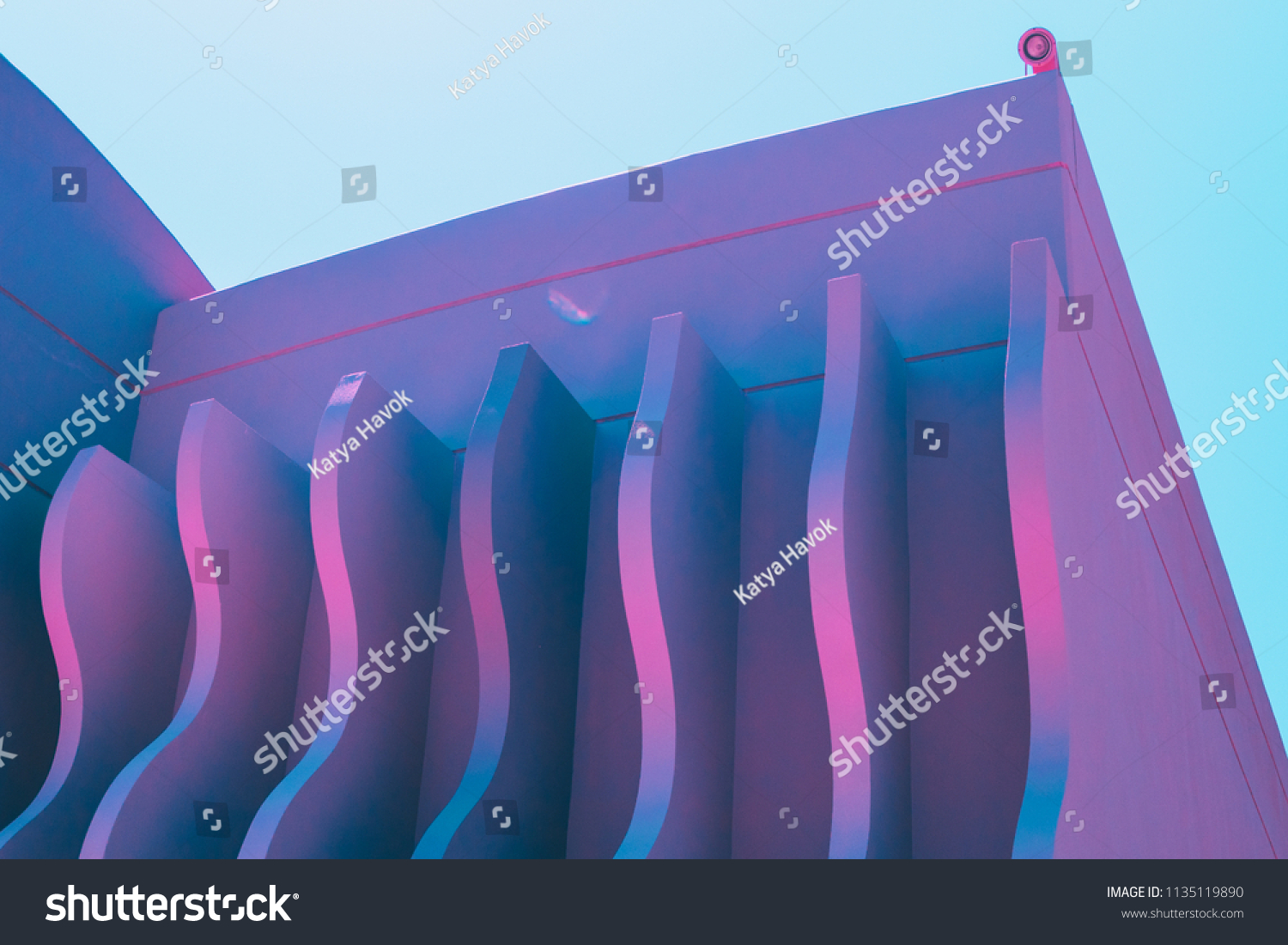 wave shapes on the hotel's wall. ultra violet holographic colors 