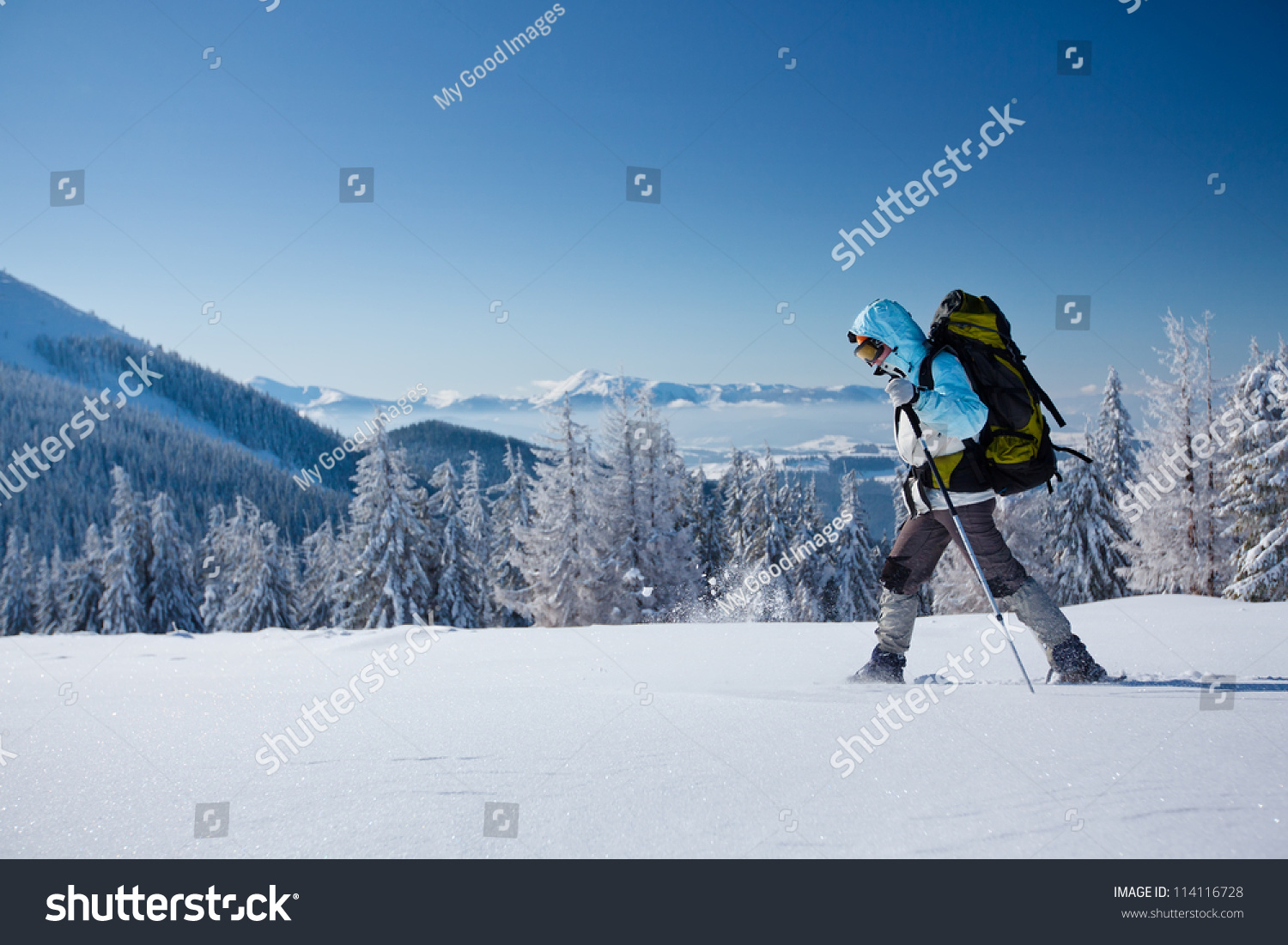 Hiker in winter mountains
