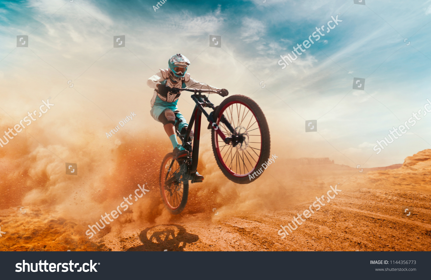 Cyclist riding a bicycle. Downhill.