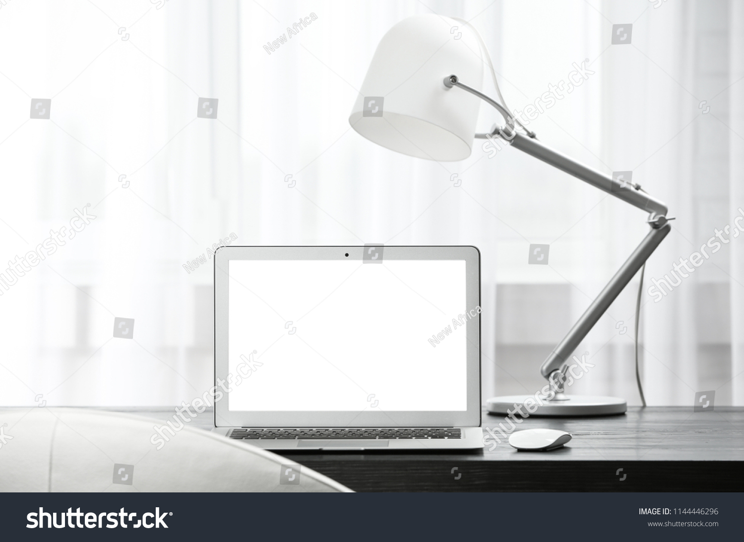 Laptop on desk in home office. Comfortable workplace