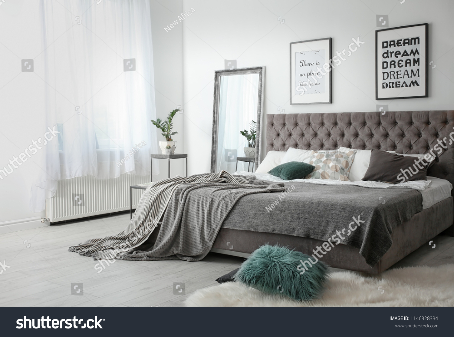 Elegant room interior with large comfortable bed