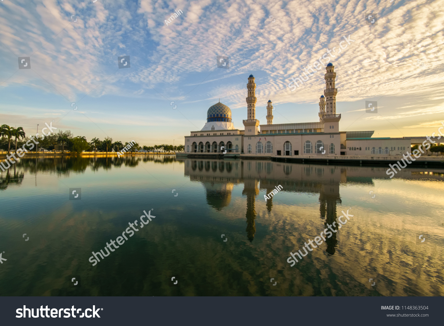 Beautiful golden sunrise over the majestic floating Kota Kinabalu City Mosque