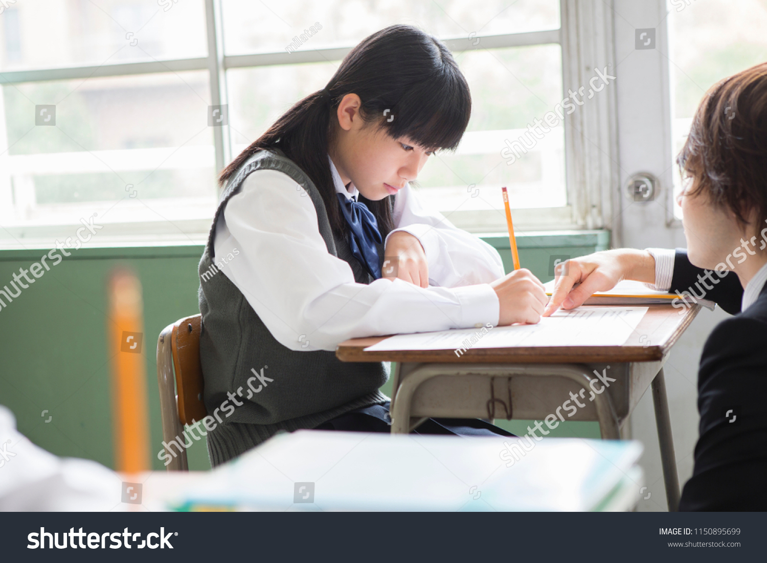 Japanese male teacher and a japanese female student