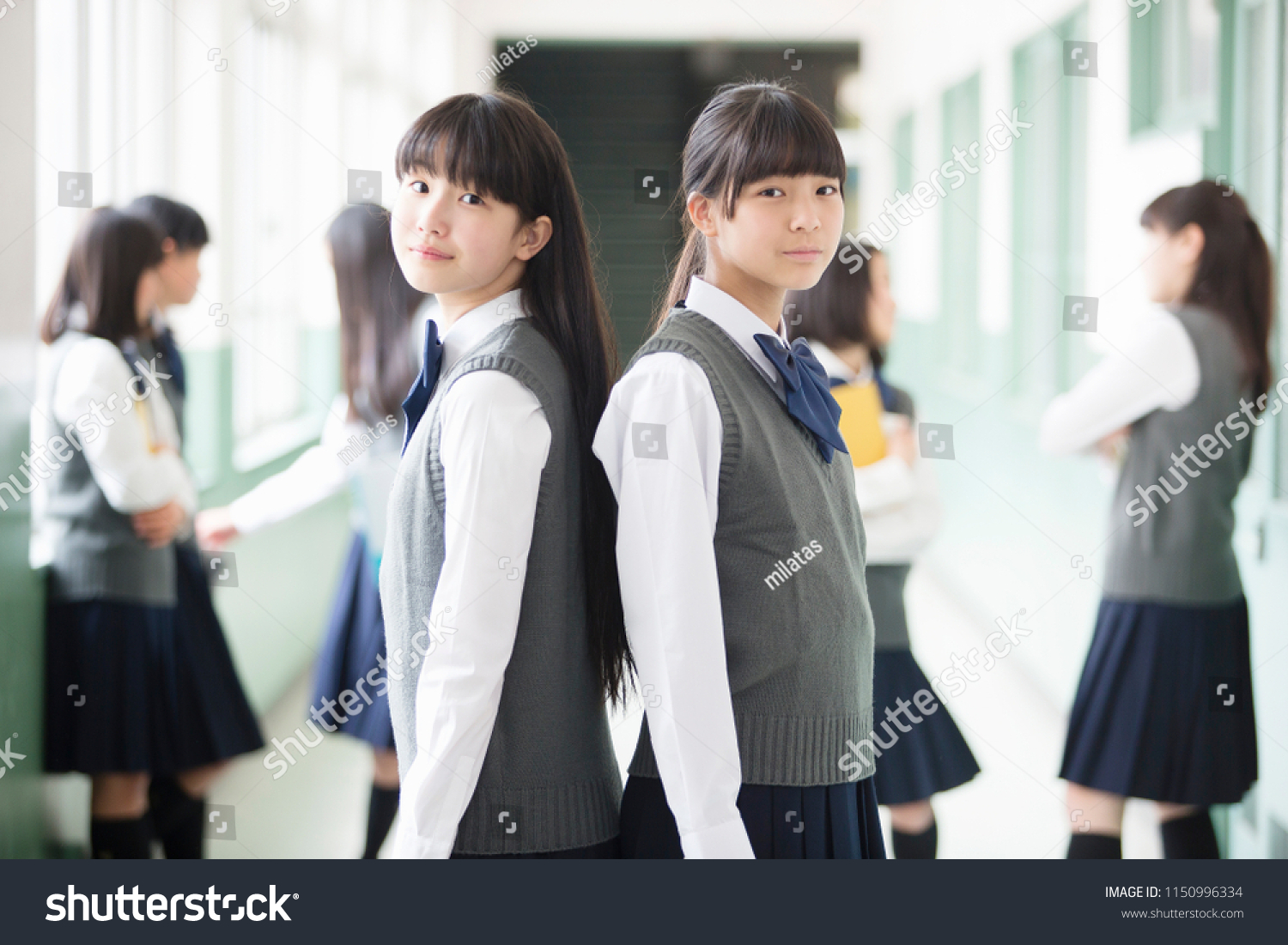 Japanese students standing in a back-to-back