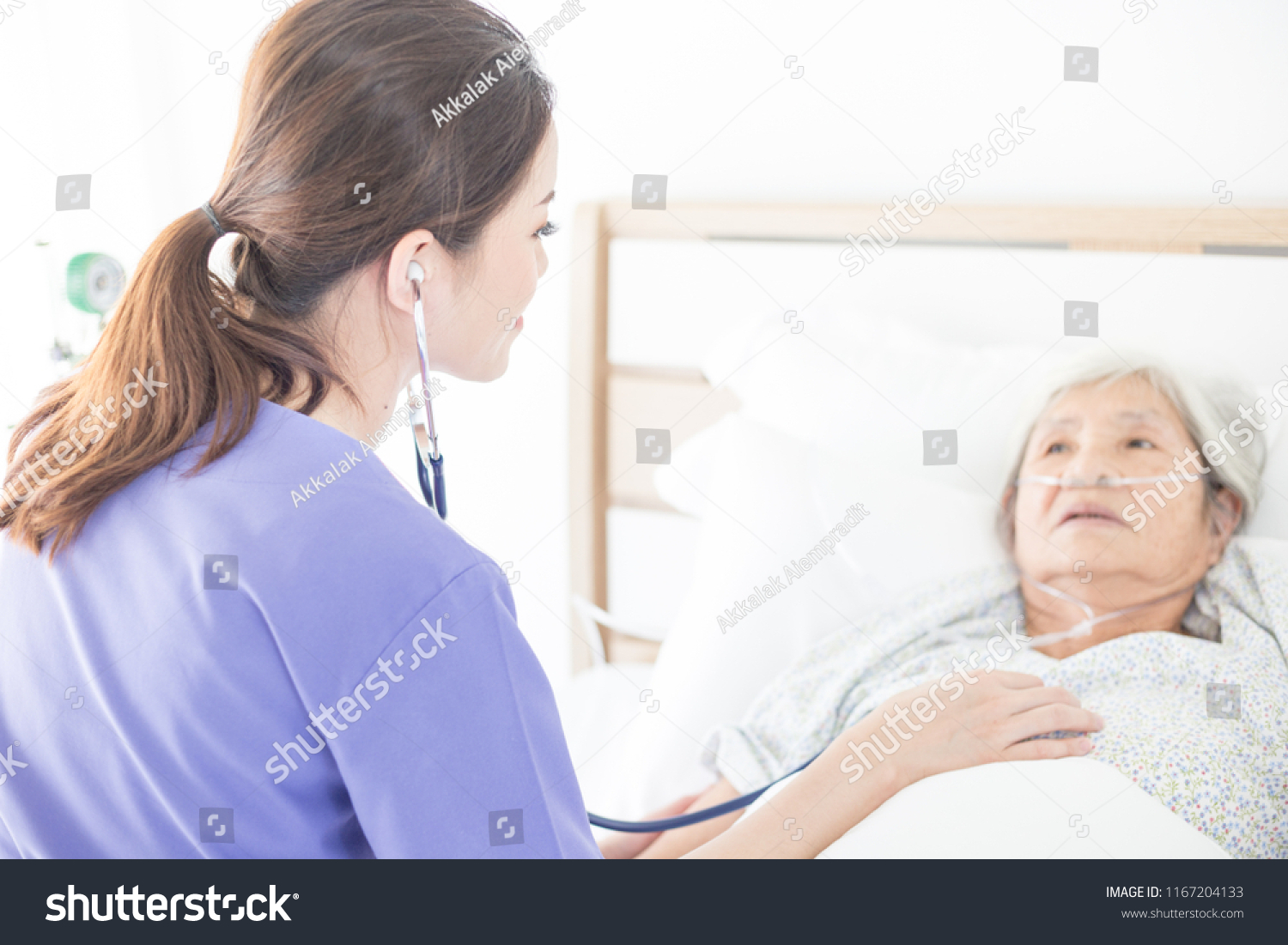 nurse screening old asian patient she explain about disease symptom elderly health check up palliative care