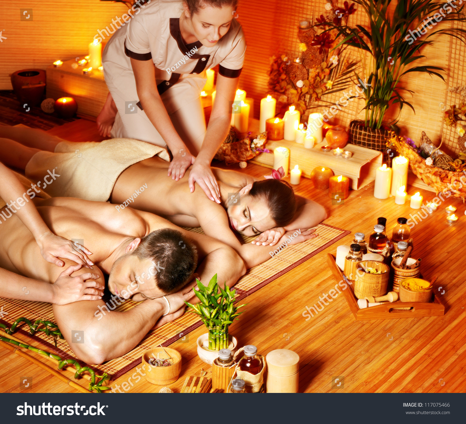 Man and woman relaxing in bamboo spa.
