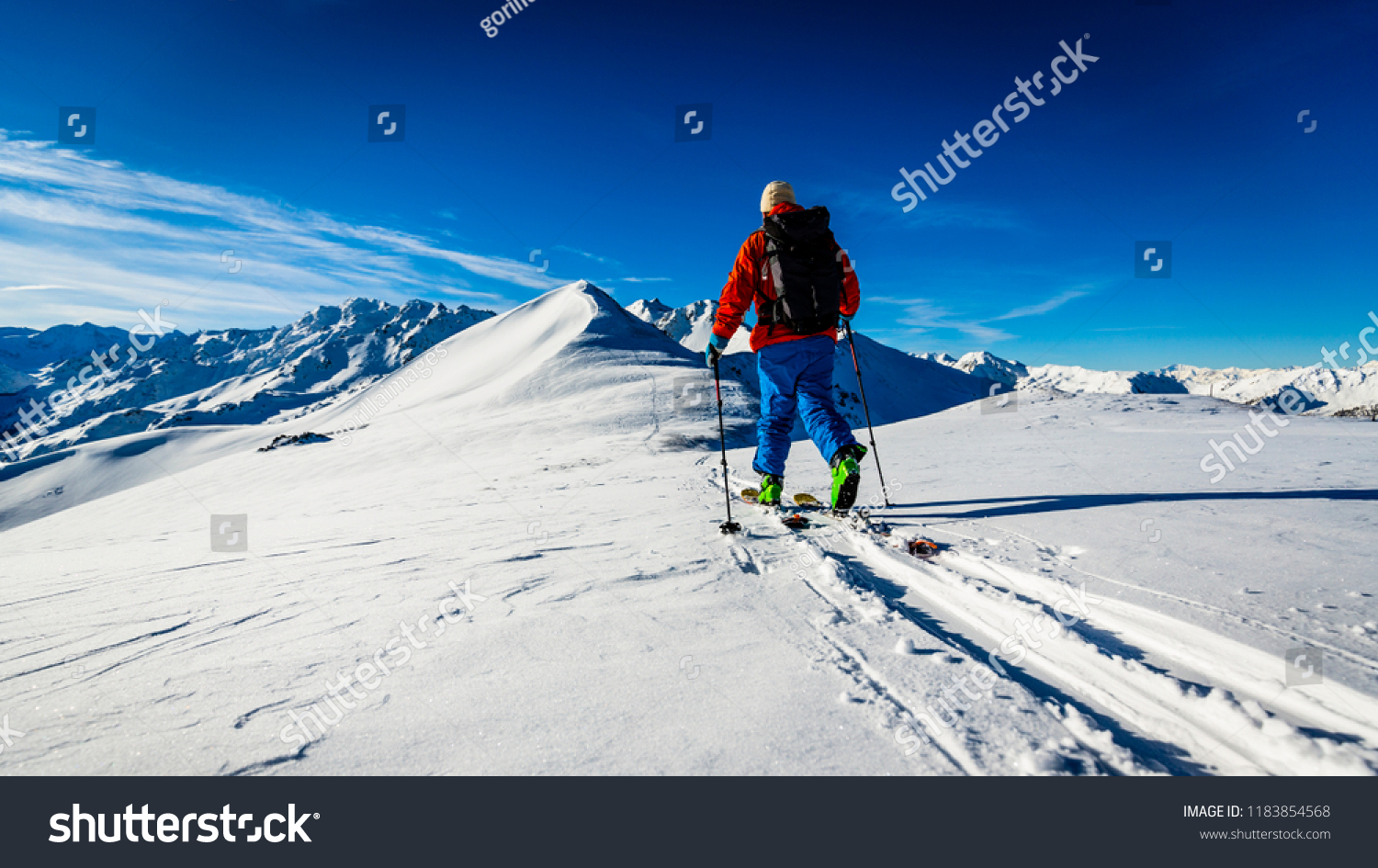 Ski with amazing view of swiss famous mountains in beautiful winter snow Mt Fort. The skituring backcountry skiing in fresh powder snow.