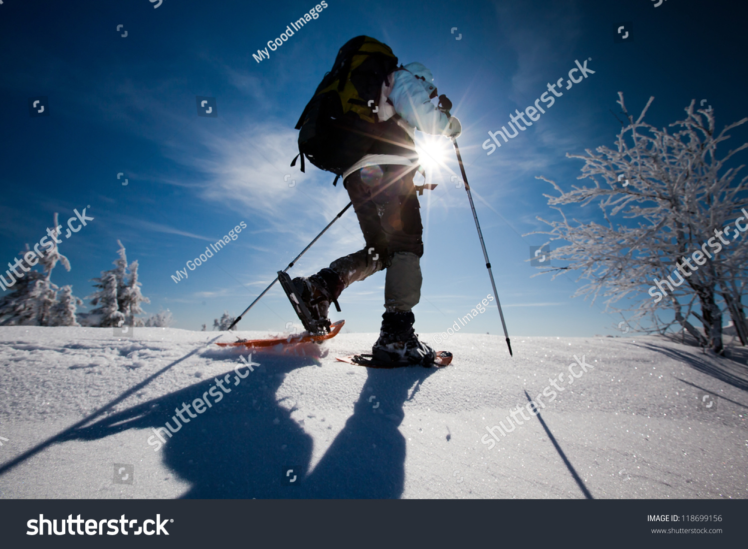 Hiker in winter mountains snowshoeing