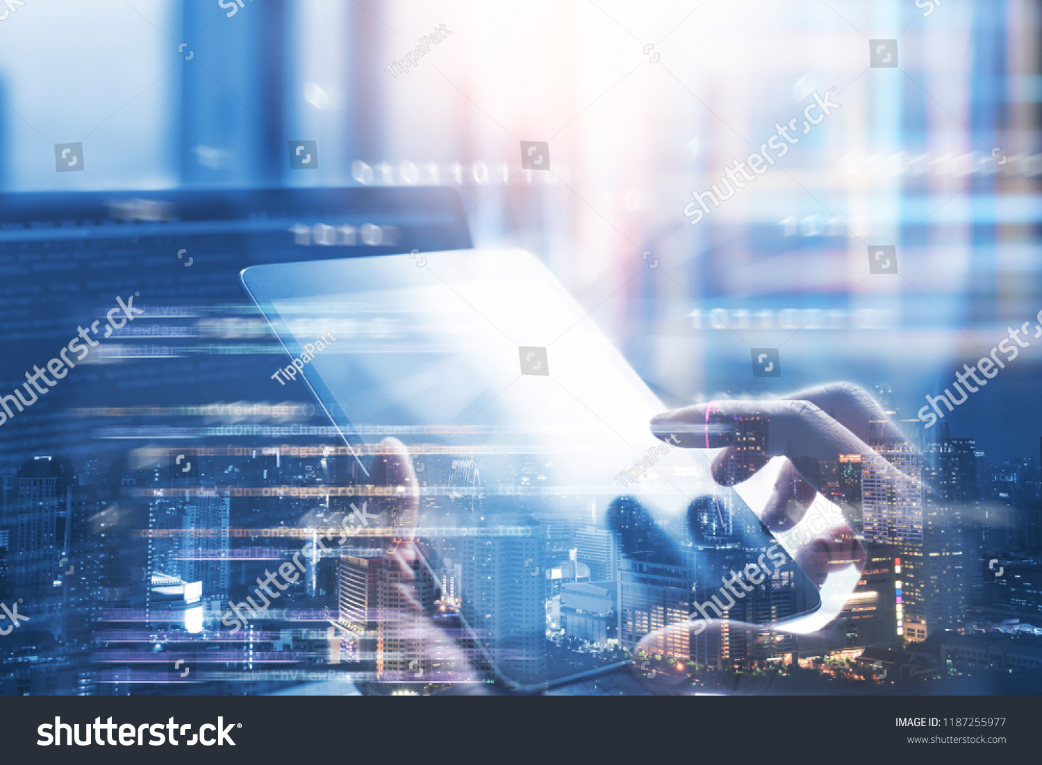 Business and technology software development IoT concept. Double exposure man programmer software developer working on digital tablet and smart city with binary html computer code on screen