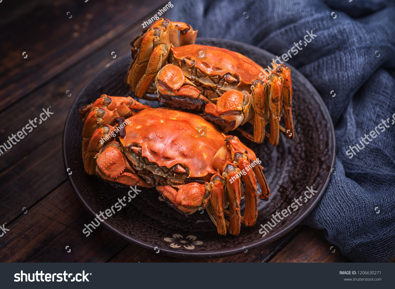 Two cooked hairy crabs on the table.