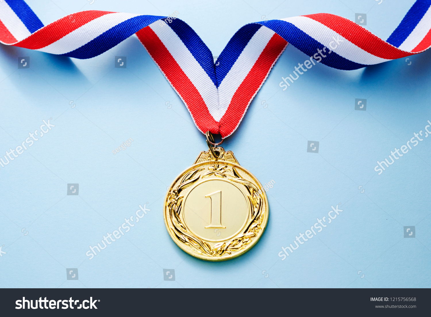 Gold medal 1 place with a ribbon on a light blue background  the concept of victory or success