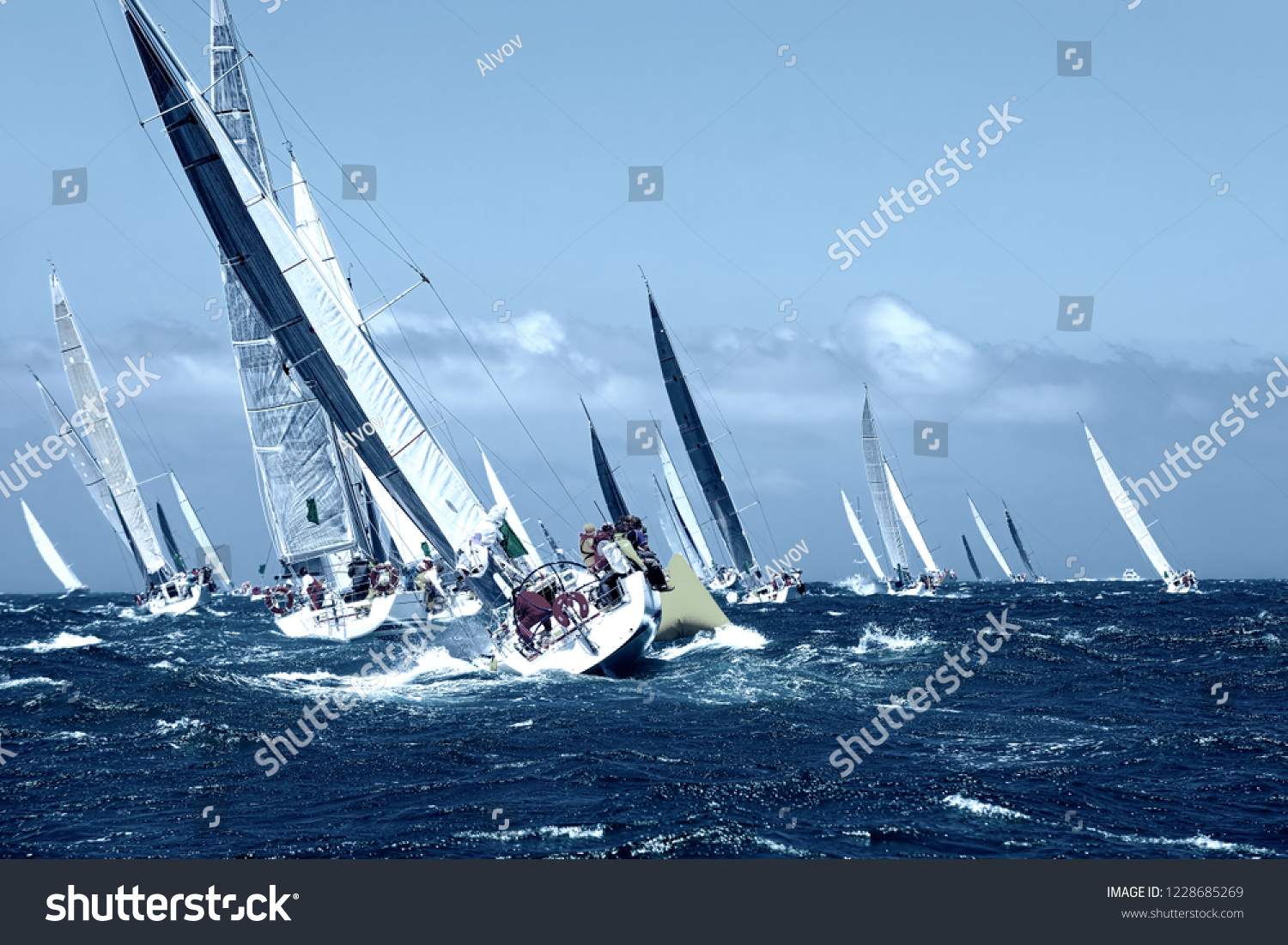 Sailboats yachts under sail with spinnakers at the regatta. Sailing yacht race. Yachting