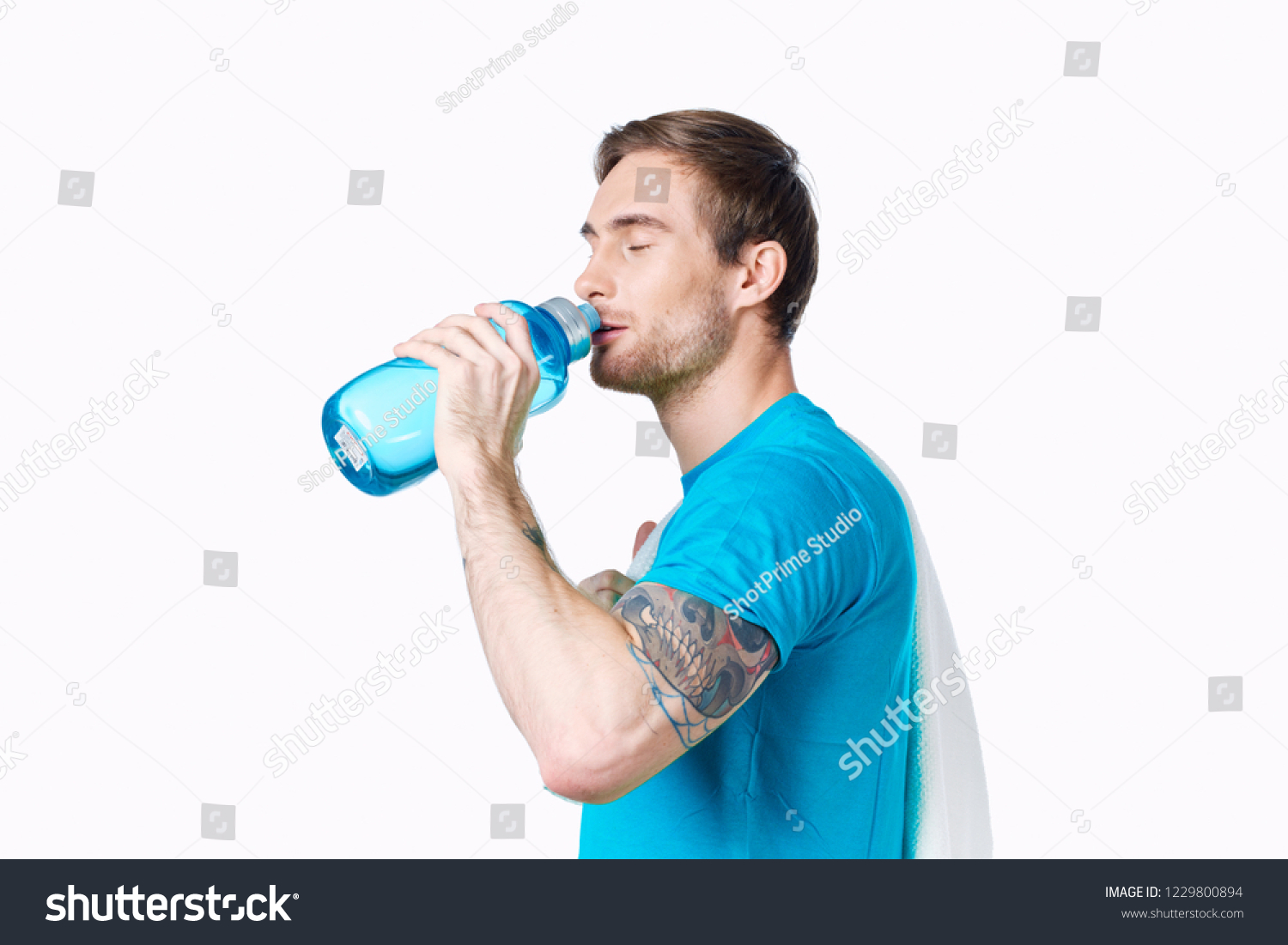 man drinking drinking water from a bottle              