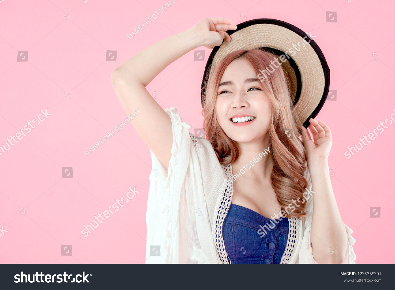 Asian woman tourist happy vacation  summer holiday clothing  pink background