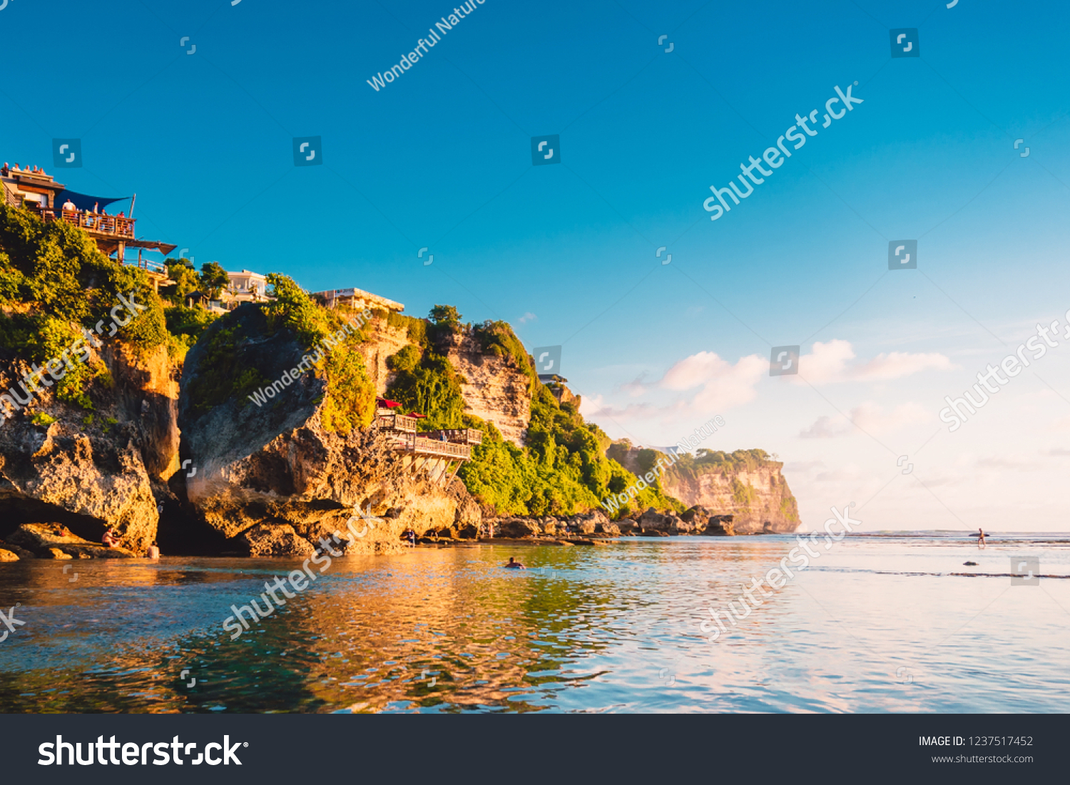 Blue sky  ocean and rocky cliff in Uluwatu  Bali and sunset light