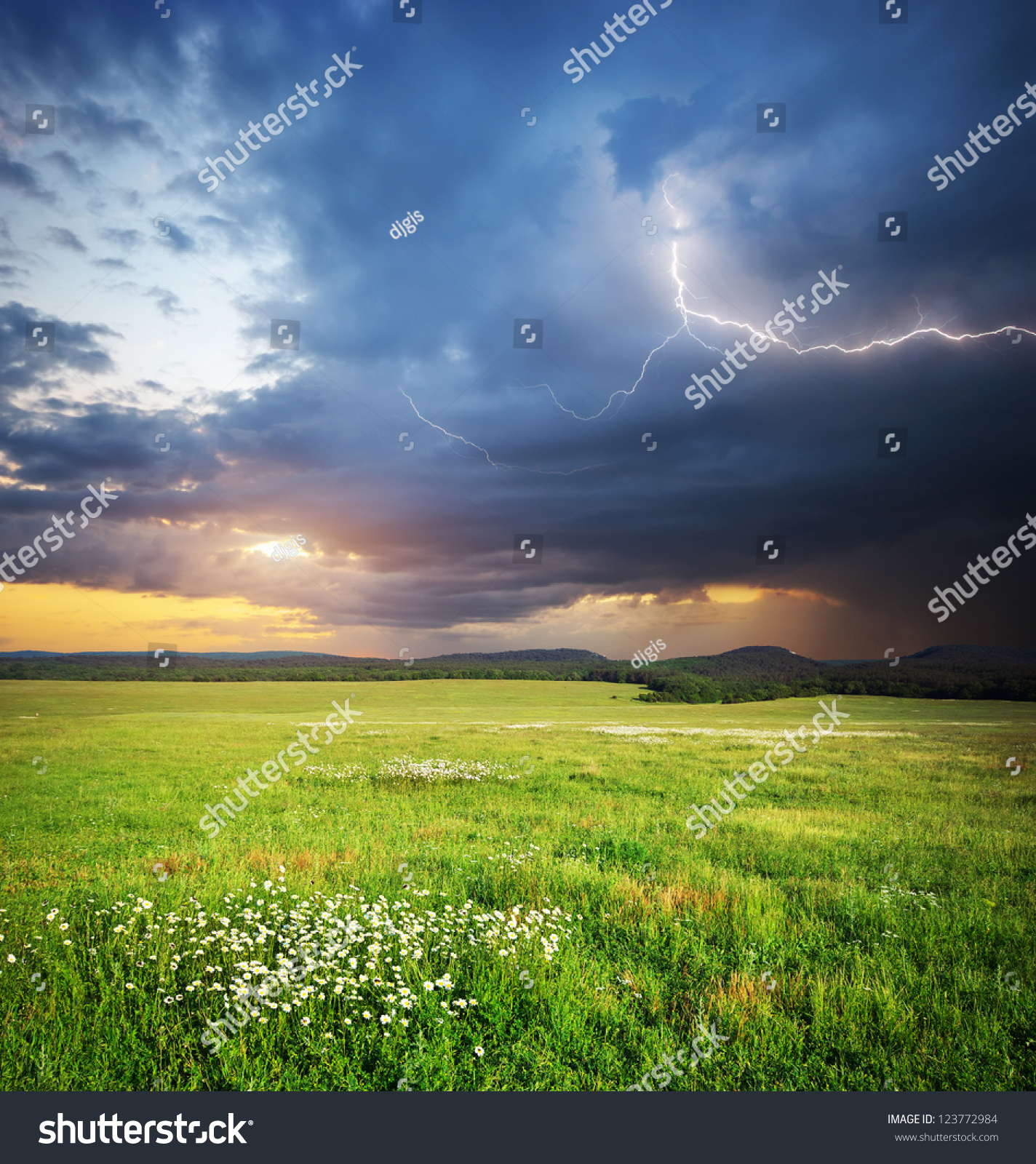 meadow in mountain rain cloud and lightning