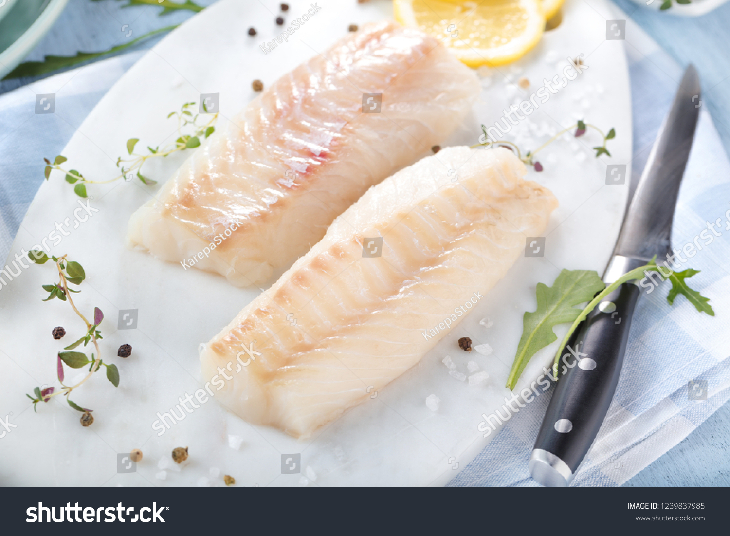Cod Fish Green Meat Fresh fish raw cod fillets with addition of herbs and lemon _站酷海洛_正版图片 ...