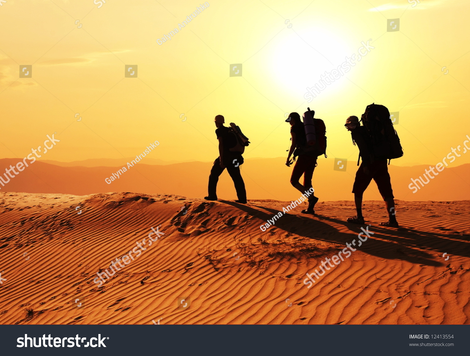 Men in sand desert