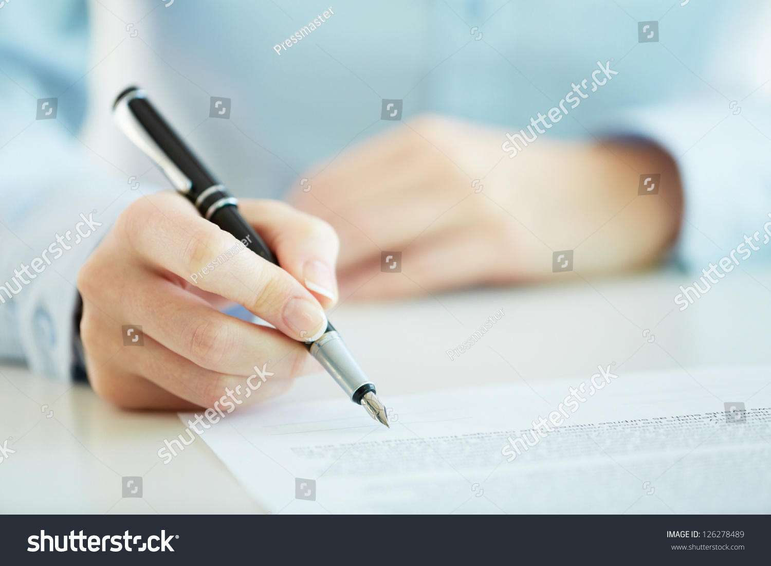 Business worker signing the contract to conclude a deal