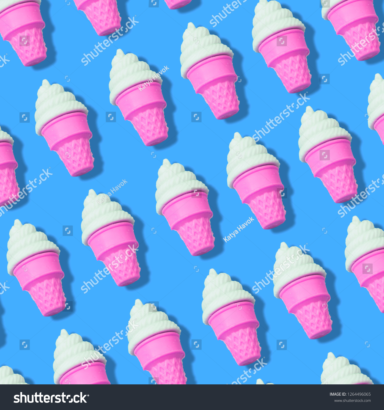 Creative art made with ice cream pattern on blue color background.  