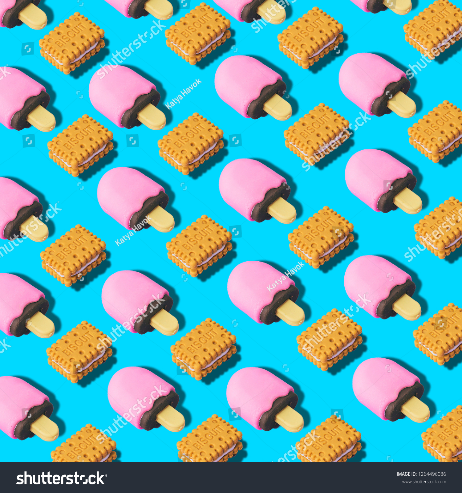 Creative art made with cookies and ice cream pattern on blue background.