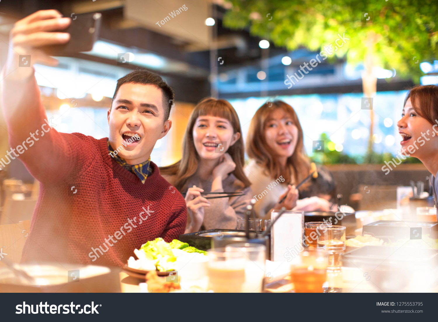 young Group  taking selfie in the restaurant