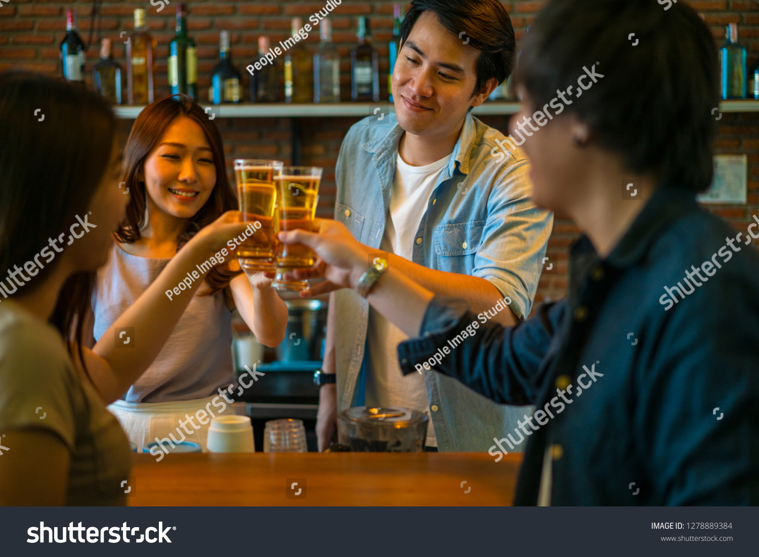 Group of Asian friend clinking a glass of beer and enjoy drinking beer at bar alcohol beer drinking friend party group of friend casual meeting bar and restaurant or friend and beer concept