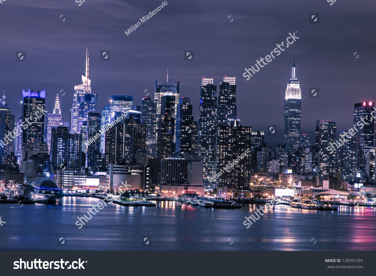 New York City Manhattan skyline panorama at night over Hudson River
