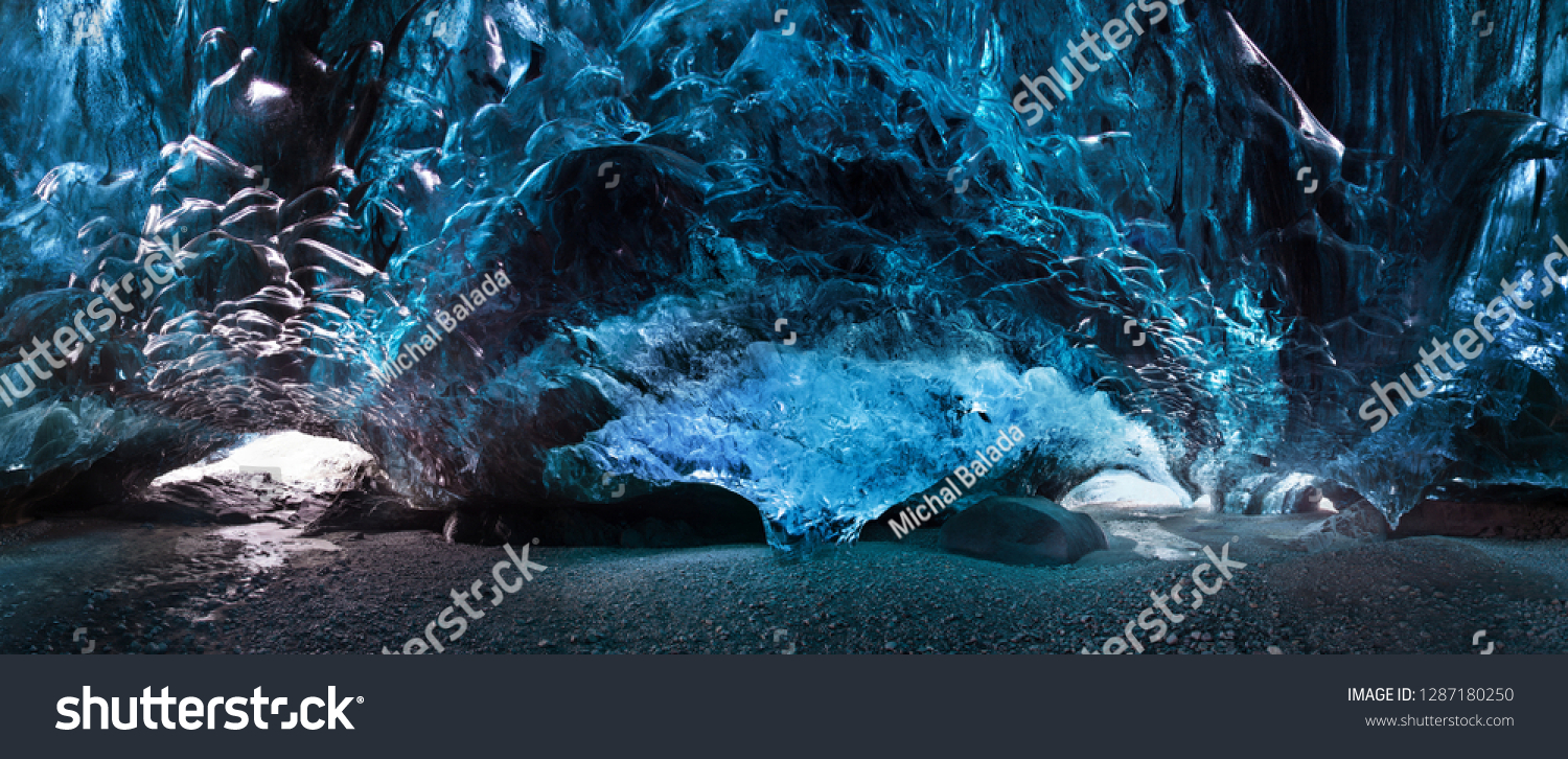 Blue crystal ice cave and an underground river beneath the glacier. Amazing nature of Skaftafell  Iceland. Vatnajokull National Park