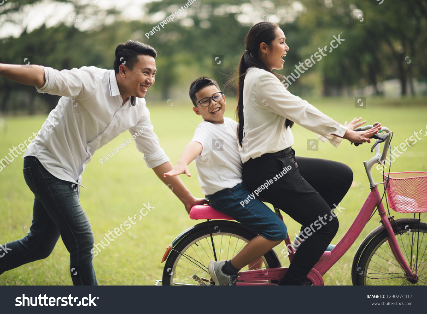 Family asian summer holiday in garden. Group of asia family enjoyed playing at the park.