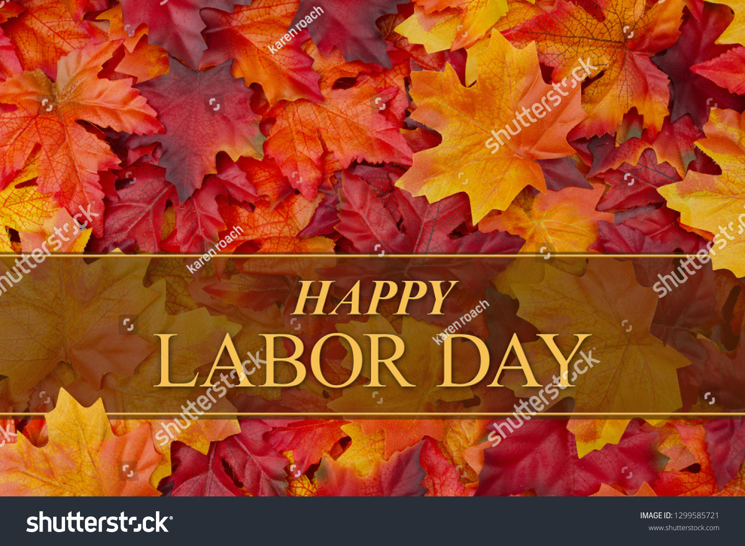 Happy Labor Day greeting with red and orange fall leaves