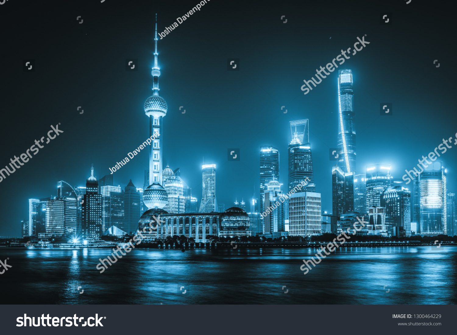 The skyscrapers of Shanghai lit up at night along the Bund.