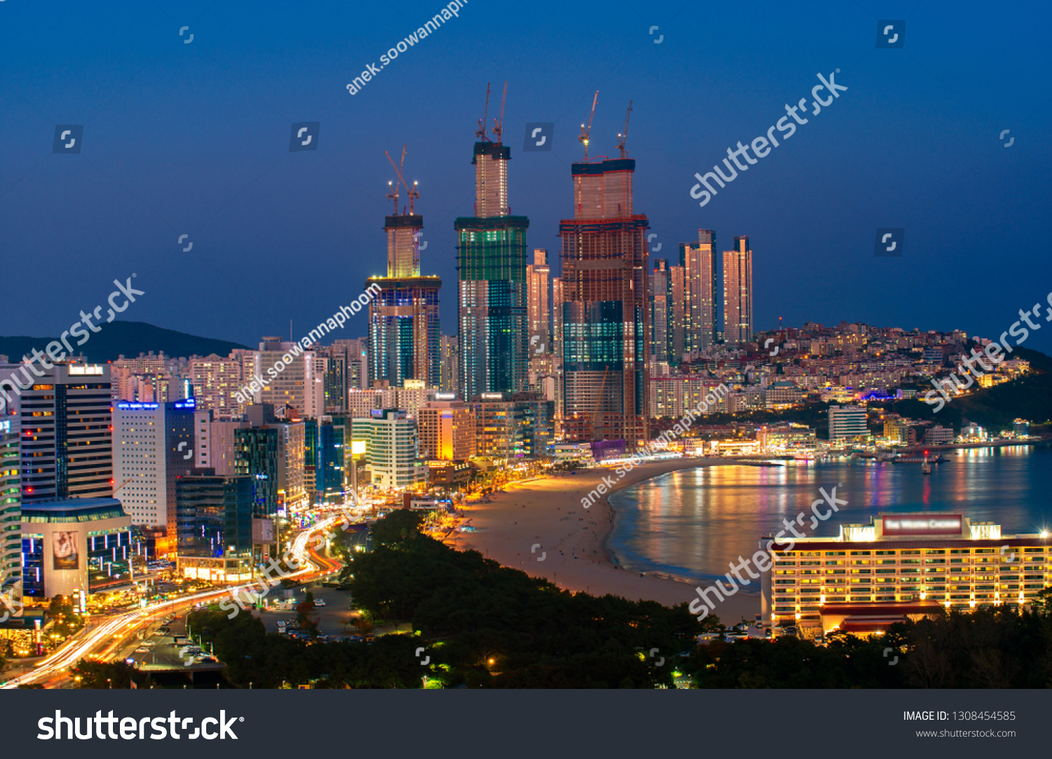 Busan beach view from roof top Busan city in night time with blue sky and full moon  South Korea  this picture can use for tavel  Busa  South Korea and  city concept
