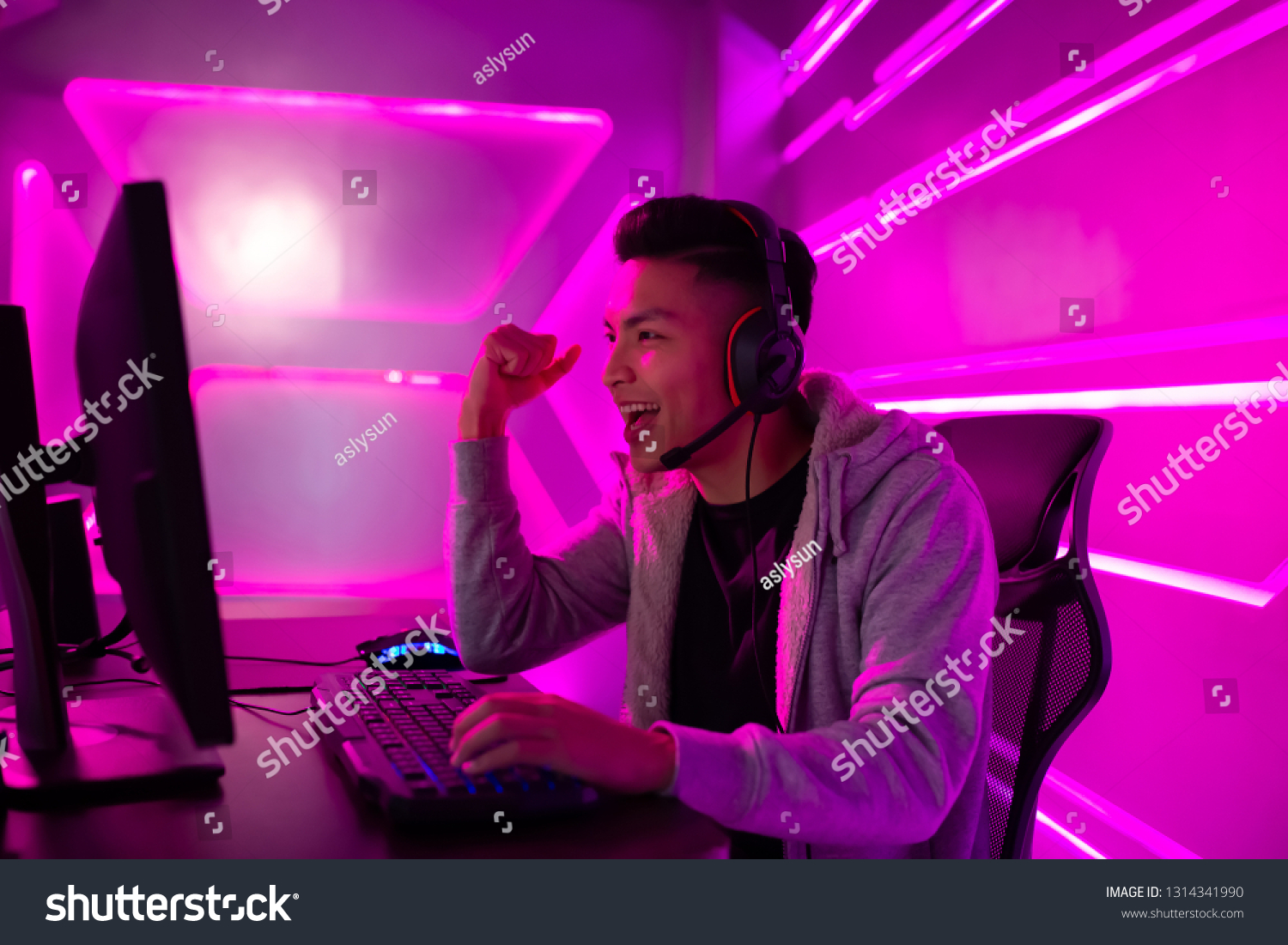 Young Asian Handsome Pro Gamer win in Online Video Game