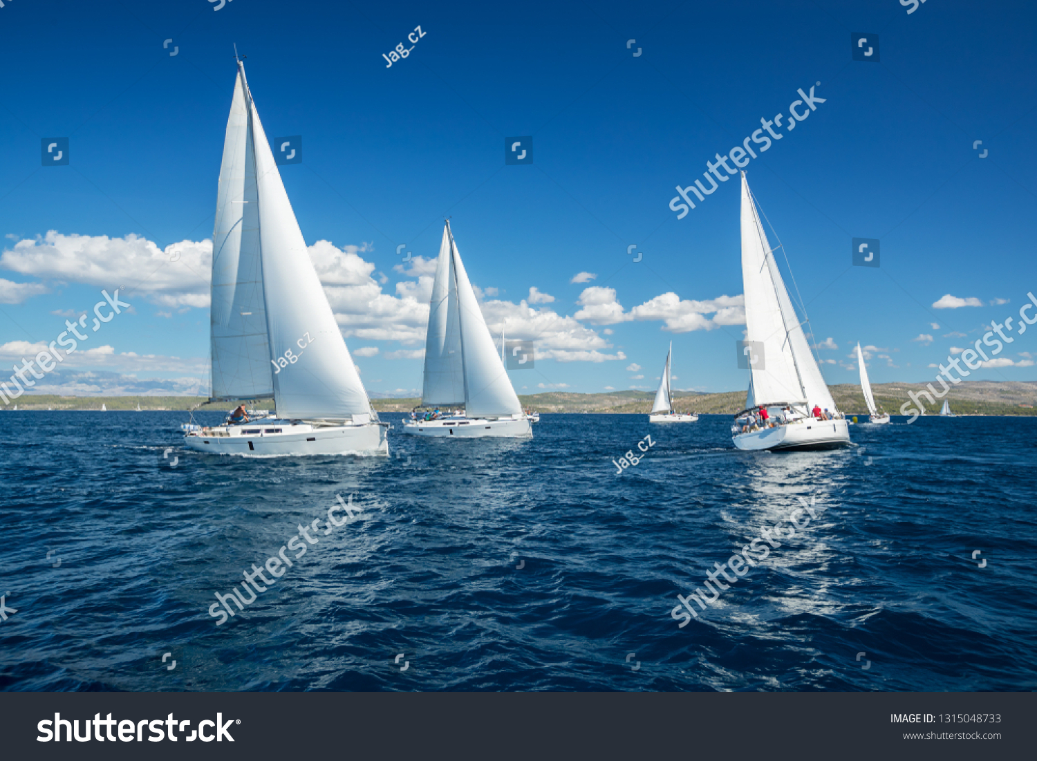 Sailing yachts regatta competition. Summer sport and recreation activities.