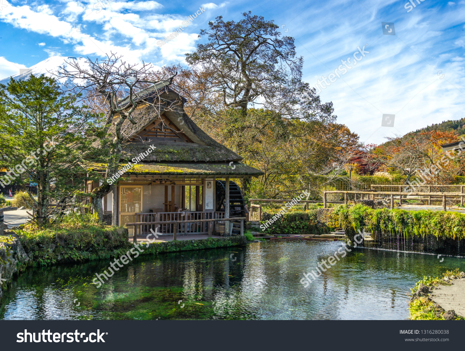 Oshino hakkai village with ponds (a small village in the Fuji Five Lake region) .Blue sky Background Mount Fuji Japan - Image