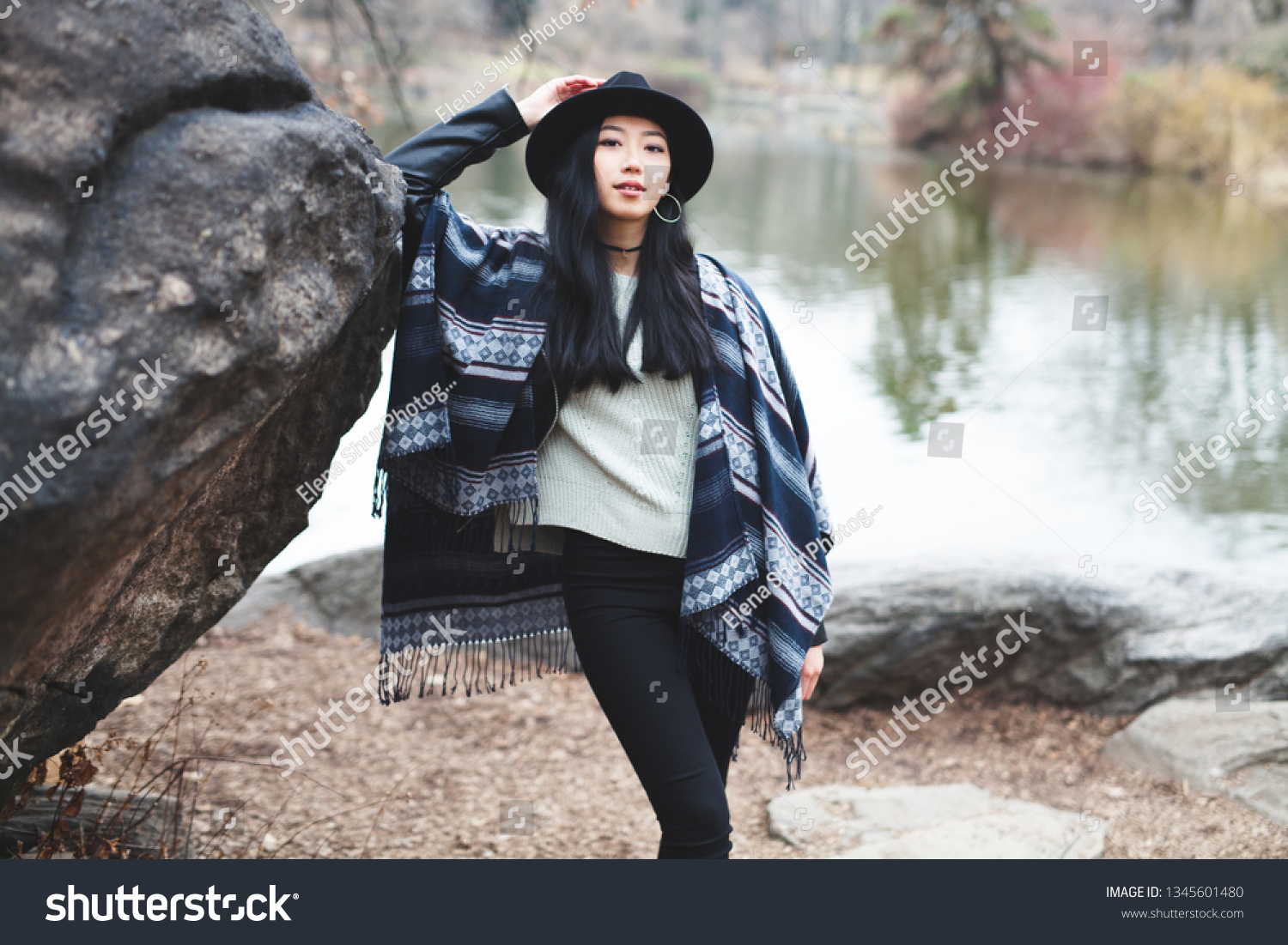 Asian girl hanging out by the lake