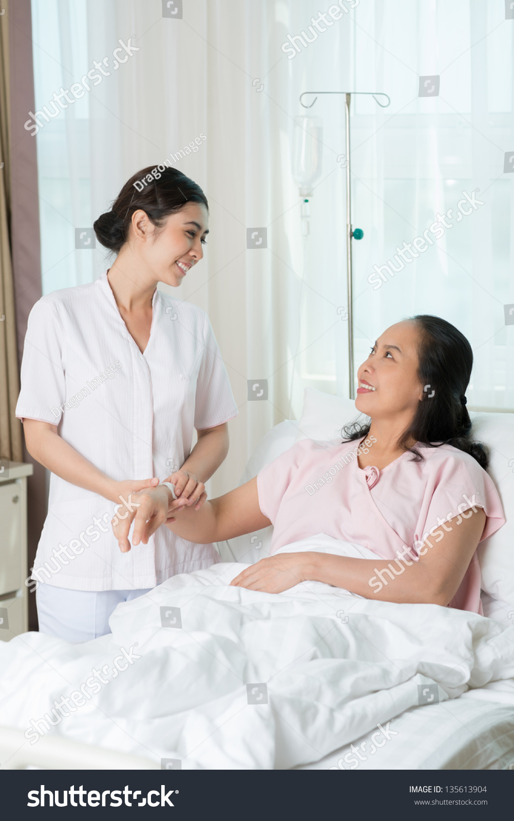 Vertical image of a nurse and a patient after iv procedures
