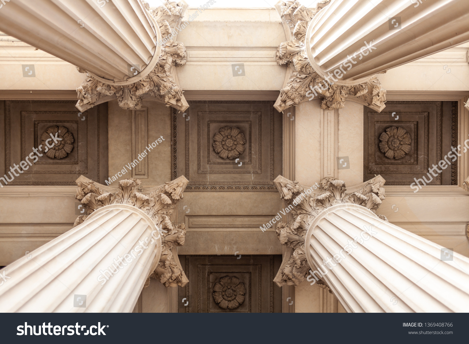 Court house or museum pillars or columns looking straight up and symmetrical 