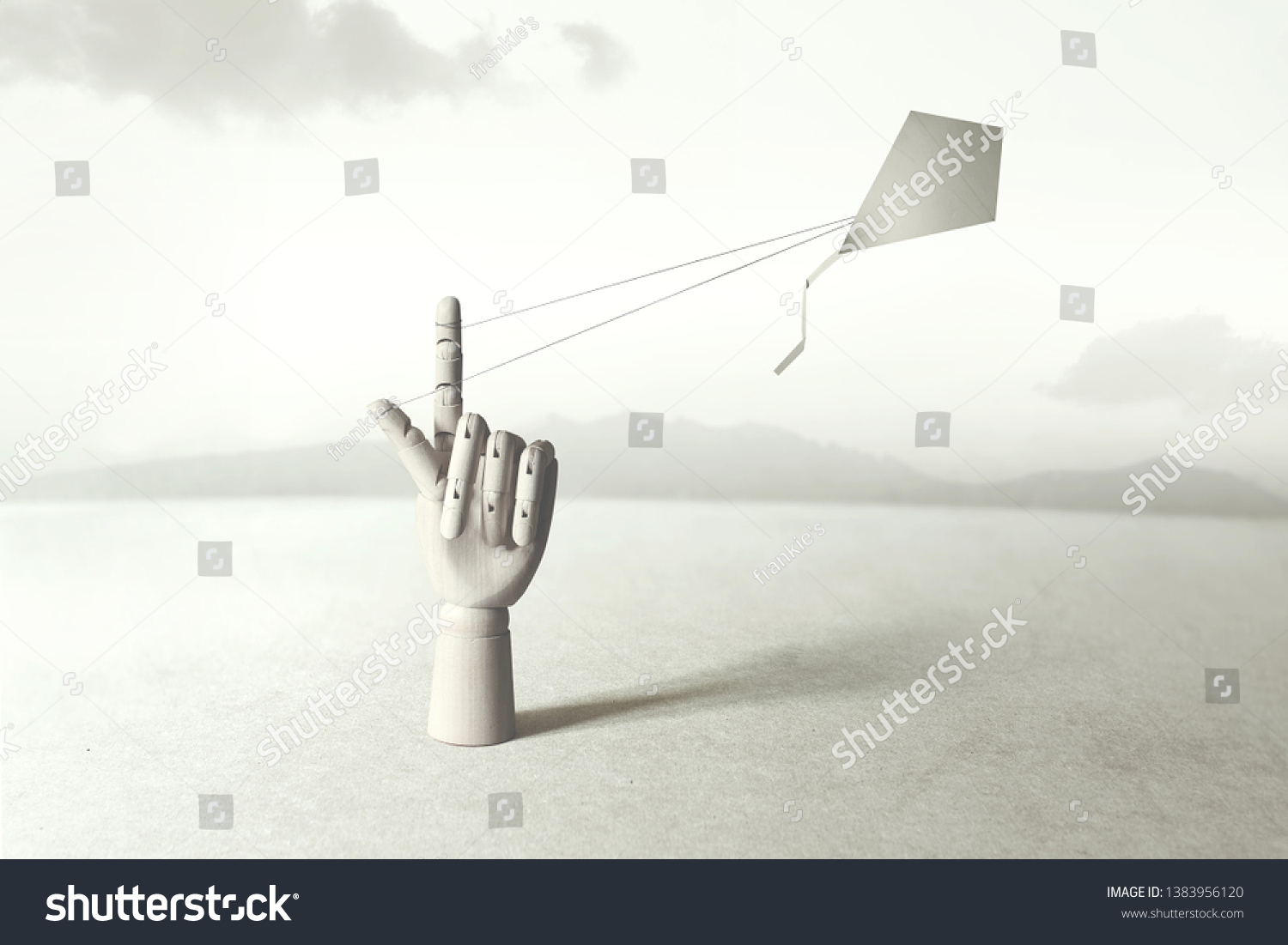 wooden hand driving kite up to the sky  surreal concept