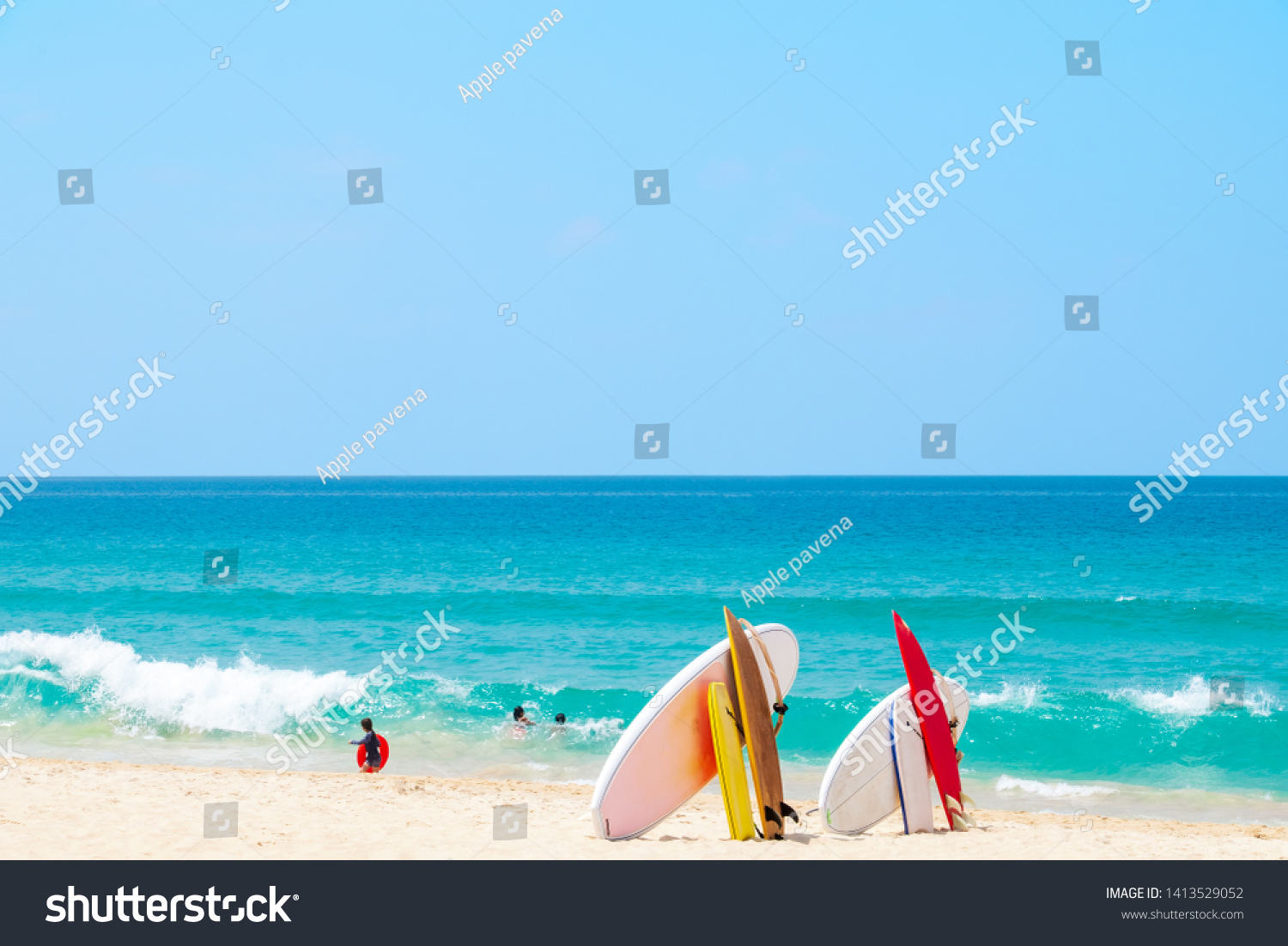 Surfboard on sand tropical beach with sea wave and blue sky background. Summer vacation background concept. - Image 