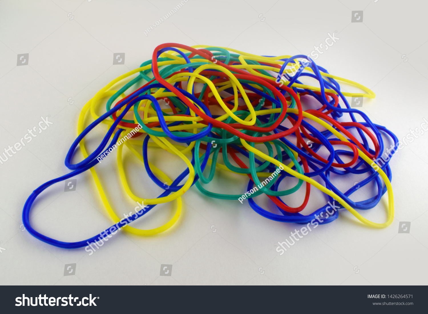 heap of rubber bands on white background. close up view