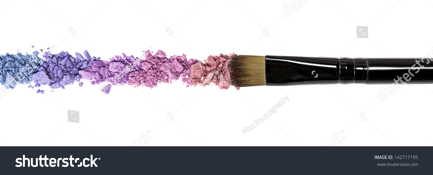 Professional make-up brush on colorful crushed eyeshadow