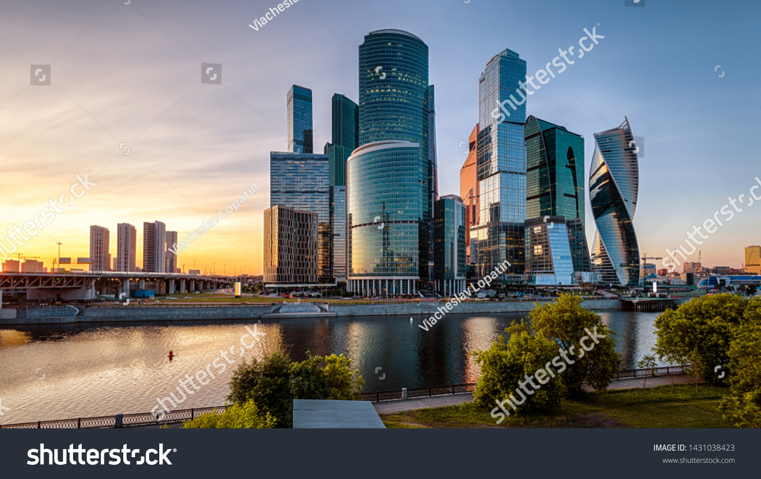 Moscow-City skyscrapers at sunset Russia. Moscow-City is a business district on embankment of Moskva River. Modern tall buildings of Moscow at dusk. Urban landscape of Moscow in summer evening.