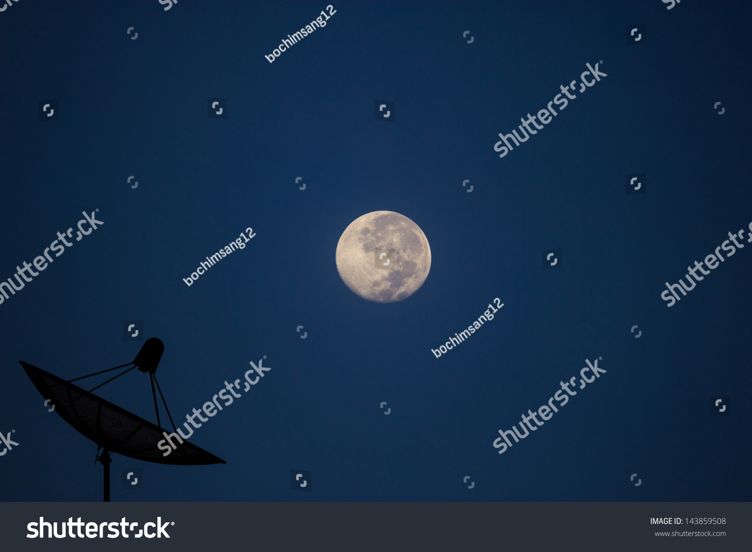 Satellite dish in evening sky with moon